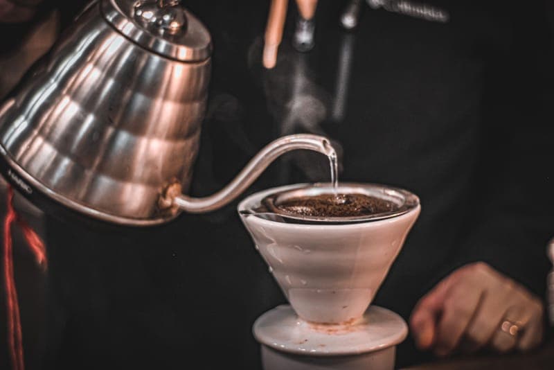 Pour-over coffee being brewed in a kitchen