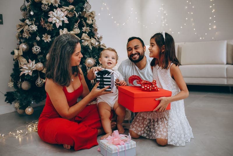 A family opening gifts on Christmas morning