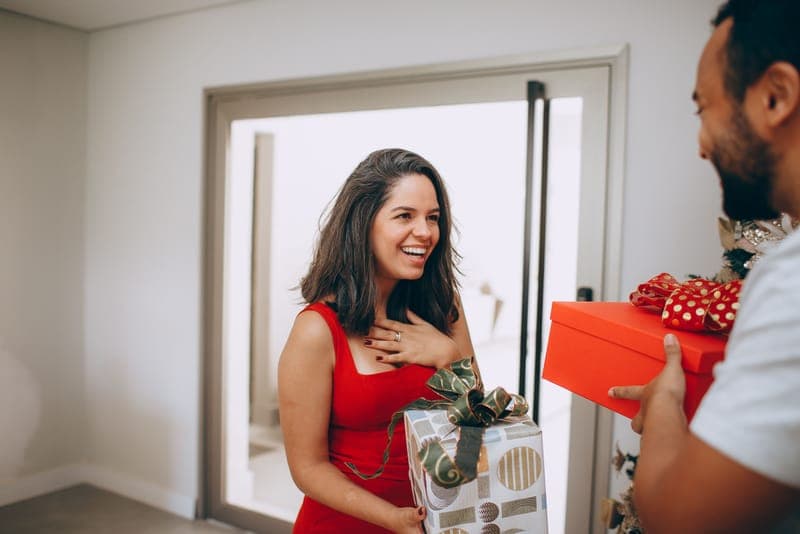 A young couple with a surprise gift
