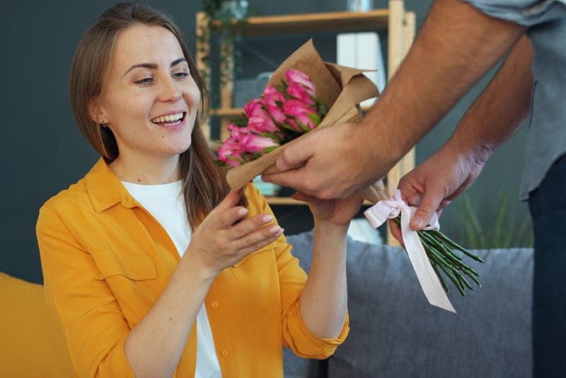 A young woman receiving a gift