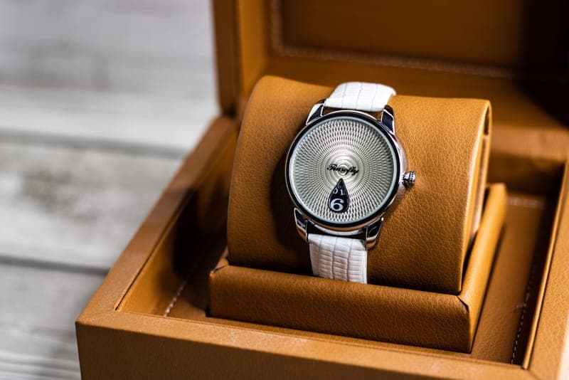 Several watches stored in a lined watch box
