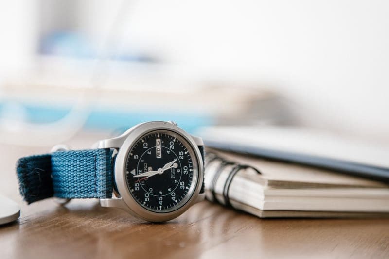 A field-style wristwatch on a canvas strap