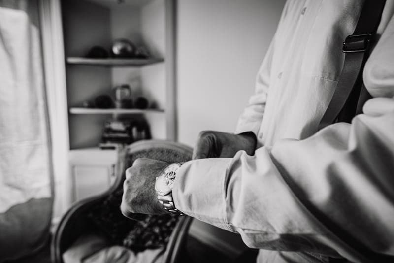 A wristwatch worn under a shirt cuff