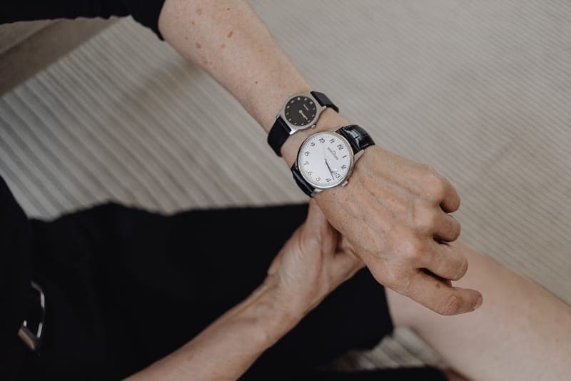 A slim wristwatch worn on a woman's wrist
